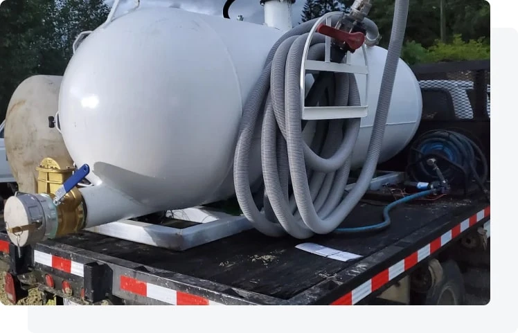 Septic service technician reviewing site conditions during a residential visit.
